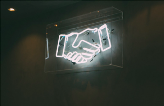 Neon handshake sign 