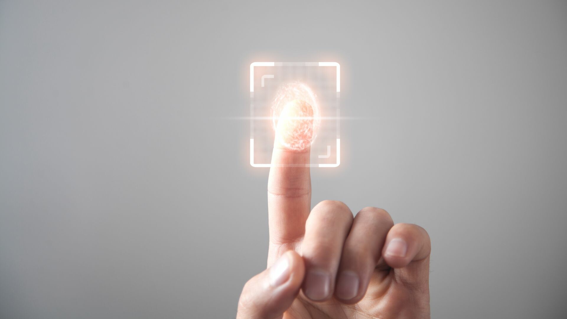 Finger pressed on a finger scanner.