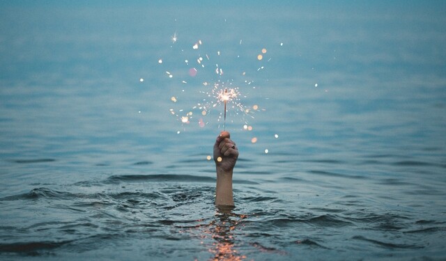 Hand holding sparkler