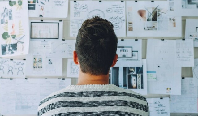 Man staring at whiteboard