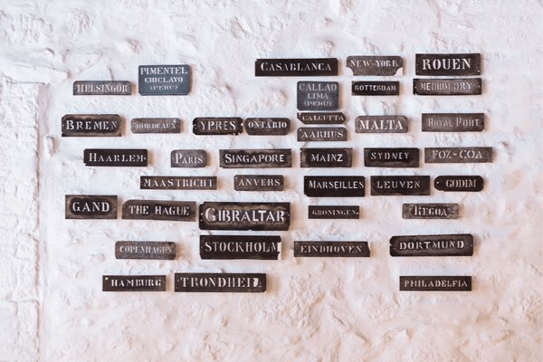 Different cities on plaques, different writing styles