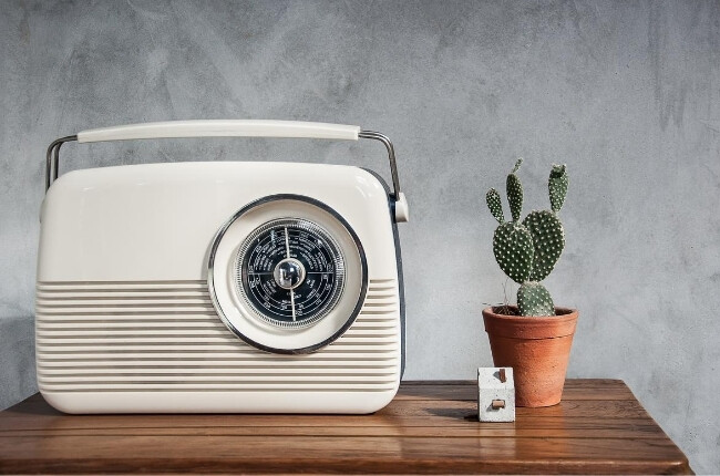 vintage white radio on a wood table