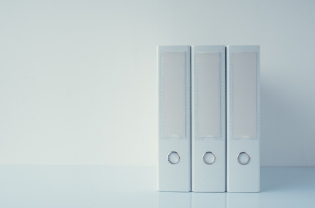 three white binders