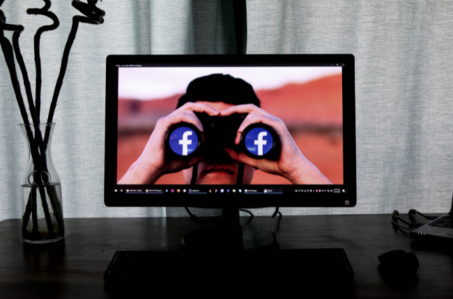 FB logo on binoculars on a computer screen