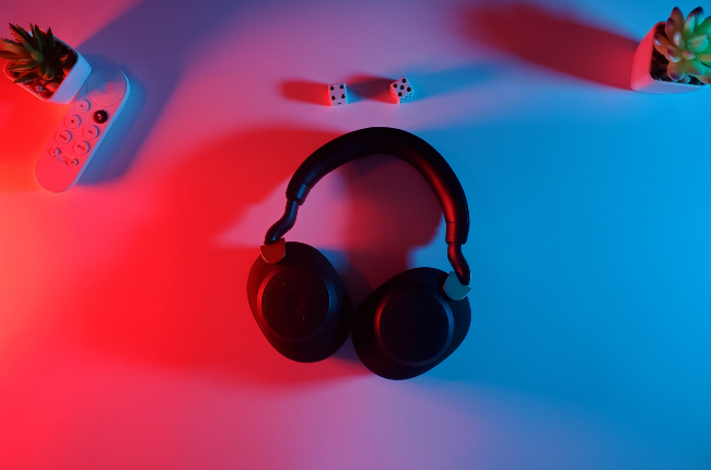 Headphones on desk with red and blue lights