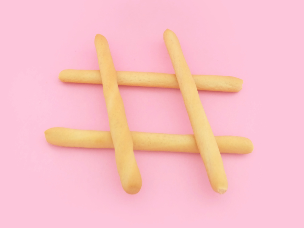 bread stick hashtag on pink background