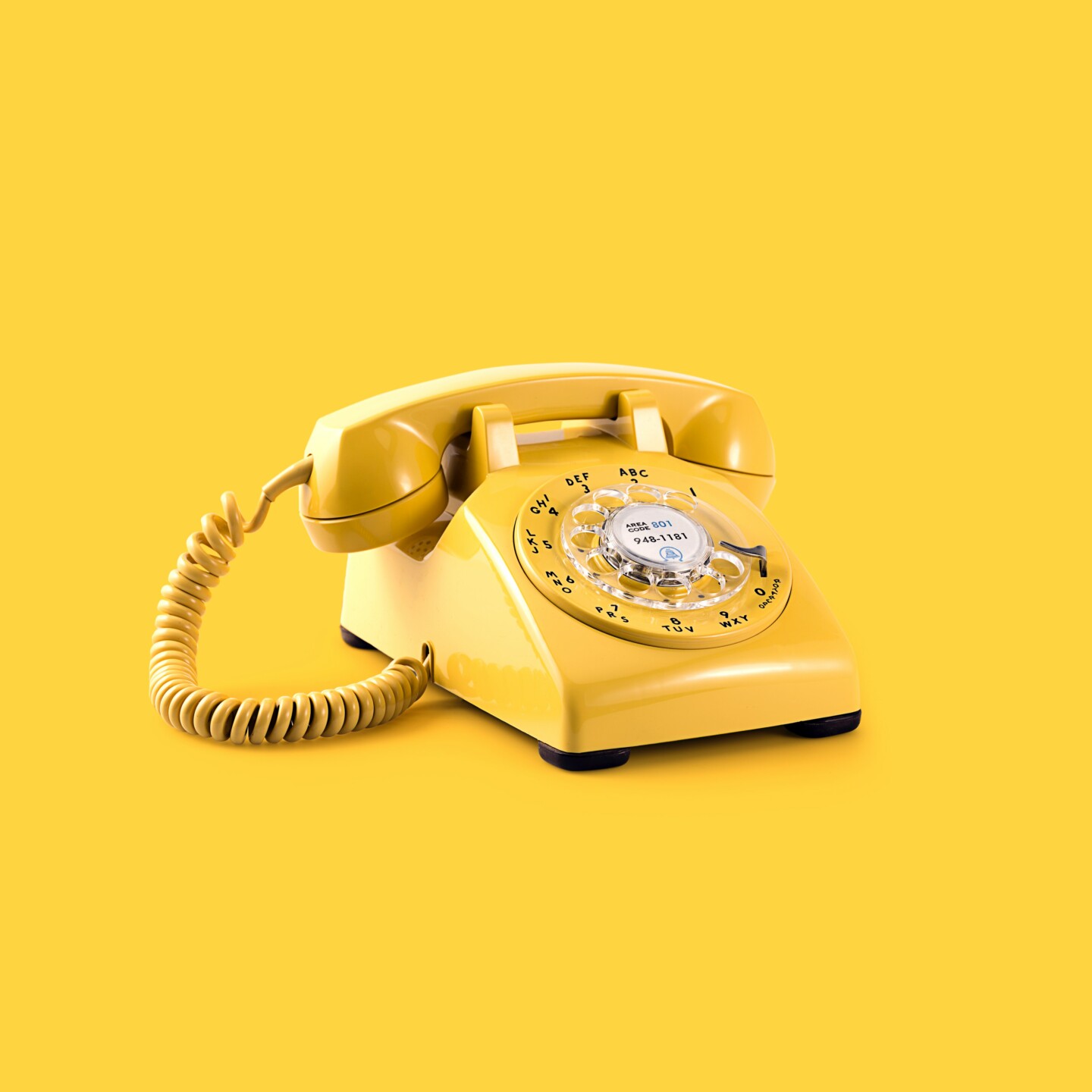 yellow old fashion phone on yellow background